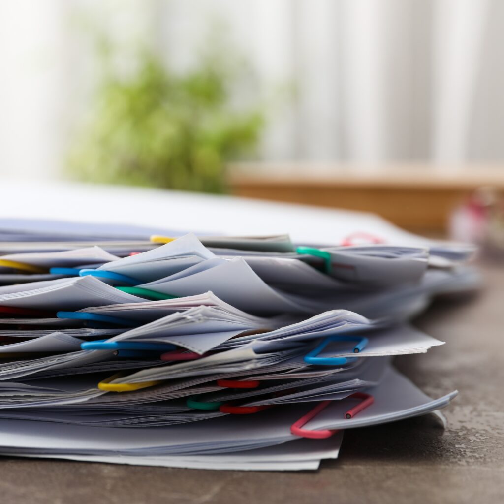 concept different office accessories paper with clip crop